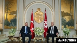 Turkey's President Tayyip Erdogan meets with Tunisia's President Kais Saied in Tunis, Dec. 25, 2019.