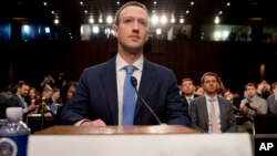 Facebook CEO Mark Zuckerberg arrives to testify before a joint hearing of the Commerce and Judiciary Committees on Capitol Hill in Washington, April 10, 2018, about the use of Facebook data to target American voters in the 2016 election. 