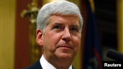 Michigan's Governor Rick Snyder gives his annual State of the State address to the Assembly at the State Capitol in Lansing, Michigan, Jan. 16, 2014.