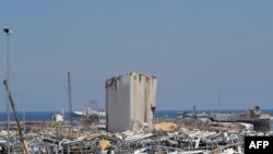 FILE - This Aug. 25, 2020, photo shows the damaged grain silos amid the destruction at Beirut's harbor, in the aftermath of the monster explosion at the port which ravaged swathes of the capital in early August.