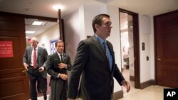 House Intelligence Committee Chairman Devin Nunes, R-Calif., followed by Rep. Chris Stewart, R-Utah, and Rep. Mike Conaway, R-Texas, far left, leave the secure area where the panel was wrapping up its inquiry into Russian meddling in the 2016 election, March 22, 2018.