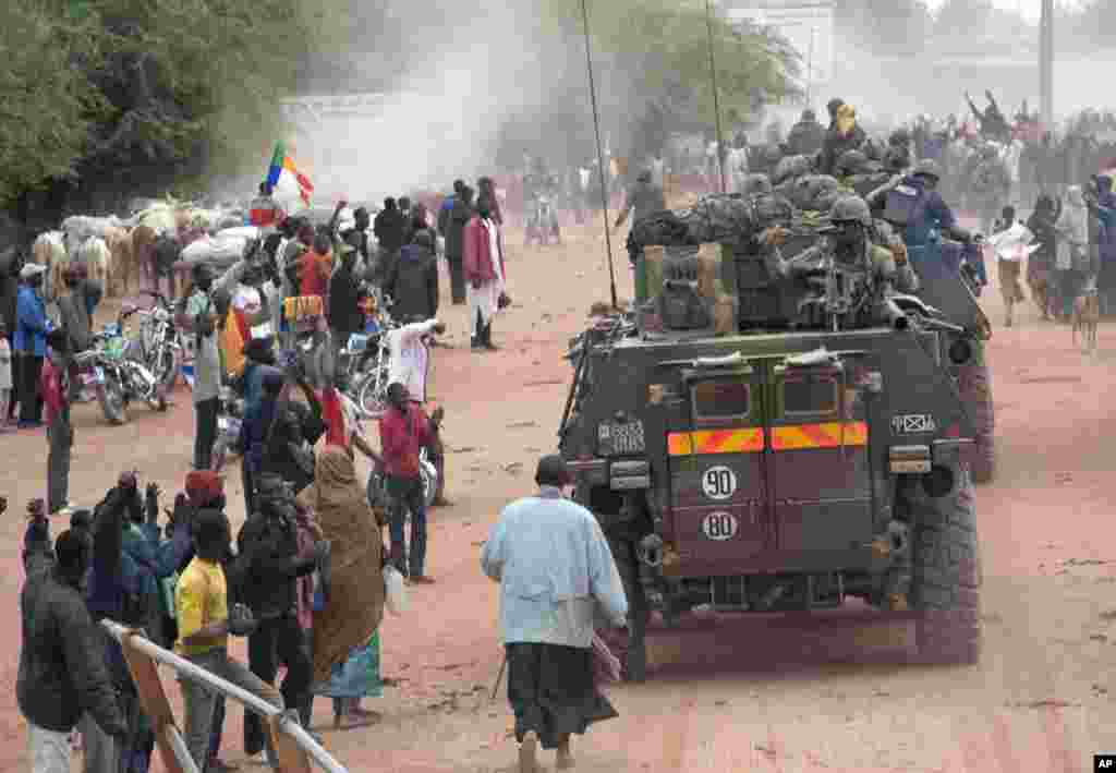 This photo released by the French Army Communications Audiovisual office shows a crowd cheering the arrival of French soldiers in Timbuktu, Mali, January 28, 2013.