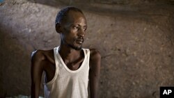 A patient with tuberculosis sits on a bed in 'Tuberculosis Village,' a separate health facility at a clinic run by the medical charity Doctors Without Borders, in the town of Nasir in southeastern Sudan. Along with malaria, tuberculosis is one of the lead
