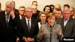 German Chancellor Angela Merkel speaks to media after exploratory talks about forming a new coalition government collapsed in Berlin, Germany, Nov. 20, 2017.