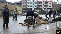 Syrian activists say two foreign journalists were killed Wednesday by government forces shelling the restive central city of Homs, Feb. 22, 2012.