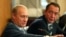 FILE - Russian President Vladimir Putin, left, gestures as Mass Media Minister Mikhail Lesin listens to him during a meeting with local press in the far eastern city of Vladivostok, Aug. 24, 2002