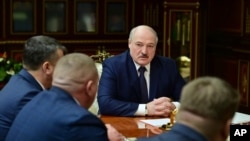 FILE - Belarusian President Alexander Lukashenko attends a meeting with top officials in Minsk, Jan. 26, 2021. 