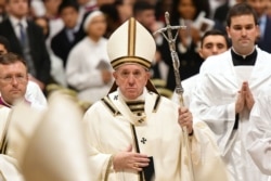 Pope Francis leads a Christmas Eve mass in St Peter's Basilica to mark the nativity of Jesus Christ on Dec. 24, 2019, at the Vatican.