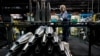 FILE - A steelworker moves an artillery projectile during the manufacturing process at the Scranton Army Ammunition Plant in Scranton, Pennsylvania, on April 13, 2023. The U.S. Defense Department said last week that some weapons deliveries to Ukraine will take months to complete.