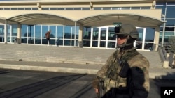 A paramilitary police officer stands at the entrance of Silivri Prison and Courthouse complex where 29 Turkish former police officers are on trial in the outskirts of Istanbul, Dec. 27, 2016.