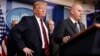 President Donald Trump, left, listens as Brandon Judd, president of the National Border Patrol Council, talks about border security after making a surprise visit to the press briefing room of the White House in Washington, Jan. 3, 2019. 