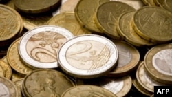 FILE - An image displays euro coins.