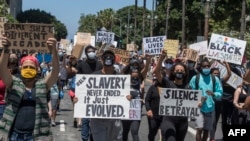 Social workers join Black Lives Matter members during a demonstration against racism and police brutality, outside City Hall in Los Angeles, California on June 13, 2020. - Demonstrations are being held across the US following the death of George Floyd on May 25, 2020, while being