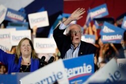 Democratic presidential candidate Sen. Bernie Sanders, I-Vt., right, with his wife, Jane, speaks during a campaign event in San Antonio, Feb. 22, 2020.