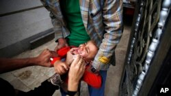 A boy receives a polio vaccination during a polio immunization campaign in Sana'a, Yemen, Aug. 15, 2015.