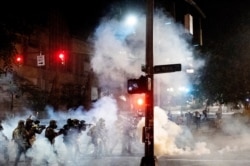 Federal agents use crowd control munitions to disperse Black Lives Matter protesters near the Mark O. Hatfield United States Courthouse in Portland, Oregon, July 20, 2020.