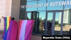Members of the LGBTQ community celebrate the judgement outside the Botswana High Court in Gaborone, Botswana.