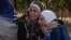 Two women whose relatives were imprisoned embrace outside the infamous Sednaya military prison, just north of Damascus, Syria, Dec. 9, 2024. Thousands of inmates were released after Bashar al-Assad's regime was overthrown Dec. 8.