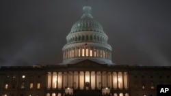 FILE - The U.S. Capitol in Washington is shrouded in mist, Dec. 13, 2019, at the end of an acrimonious week of partisan disputes in the House Judiciary Committee, which approved two articles of impeachment against President Donald Trump.