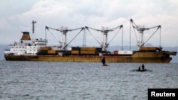  A cargo vessel docked at sea is pictured after colliding with passenger ferry St Thomas of Aquinas, in Talisay, Cebu, central Philippines, Aug. 17, 2013.