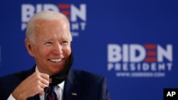 Democratic presidential candidate former Vice President Joe Biden smiles while speaking during a roundtable on economic reopening with community members, June 11, 2020, in Philadelphia. 