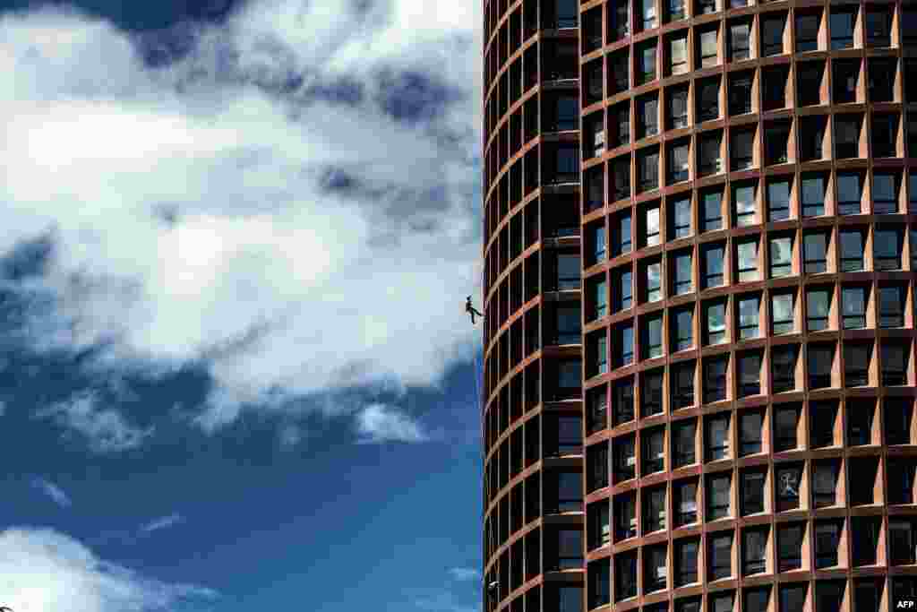 A soldier of the 7th regiment of Materiel (7e RMAT) climbs the Lyon Part-Dieu tower to celebrate regiment's 130th anniversary in Lyon, France.