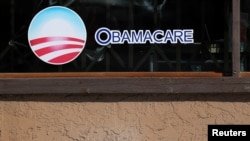 FILE - A sign on an insurance store advertises Obamacare in the San Ysidro district of San Diego,Calif., Oct. 26, 2017. 