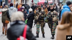 Soldiers from the Belgian army patrol in the picturesque Grand Place in Brussels, Nov. 20, 2015. 