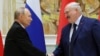 FILE - Russian President Vladimir Putin, left, and Belarusian President Alexander Lukashenko shake hands during a signing ceremony in Minsk, Belarus, Dec. 6, 2024. 