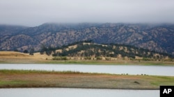 Lake Berryessa is seen with parts of California's newest national monument in the background, July 10, 2015, near Berryessa Snow Mountain National Monument.