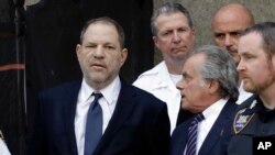 FILE - Harvey Weinstein, left, and his attorney Benjamin Brafman leave court in New York, June 5, 2018. 