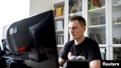 Warsaw-based Belarusian blogger Stsiapan Putsila, known under the pseudonym NEXTA, is seen during an interview with Reuters, in Warsaw, Poland, August 28, 2020.