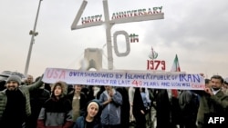 Iranians pose for a picture as they assemble with others in the capital Tehran's Azadi (Freedom) square on Feb. 11, 2019, during a ceremony celebrating the 40th anniversary of Islamic Revolution. 