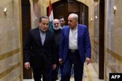 Iranian Foreign Minister Abbas Araghchi, left, and Lebanon's Parliament Speaker Nabih Berri leave after their meeting in Beirut, Oct. 4, 2024. Araghchi vowed support for Tehran's 'friends' in Lebanon.