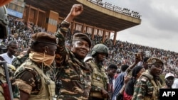 General Abdourahamane Tchiani, second from left, the head of the military regime in Niger, greets thousands who gathered in Niamey to celebrate the first anniversary of his coming to power after the July 26, 2023, coup that overthrew civilian president Mohamed Bazoum. 