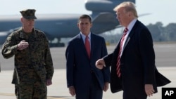 President Donald Trump passes Joint Chiefs Chairman Gen. Joseph Dunford, left, and National Security Adviser Michael Flynn as he arrives last month in Florida via Air Force One. Flynn resigned this week following reports spoke with a Russian diplomat about U.S. sanctions before Trump's inauguration. (AP Photo/Susan Walsh)