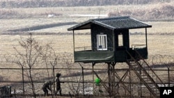 South Korean soldiers check barbed-wire fence near the border village of the South Korean soldiers check the barbed-wire fence near the DMZ that separates the two Koreas since the Korean War (file photo).