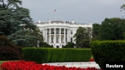 FILE - A view of the White House and South Lawn fountain in Washington.