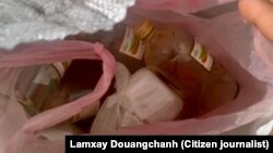 ແກ້ວ​ເຫຼົ້າ​ຂາວ​ເກົ່າ​ທີ່​ໂຮງ​ງານ​ນຳ​ກັບ​ເອົາ​ມາ​ໝູນ​ໃຊ້.