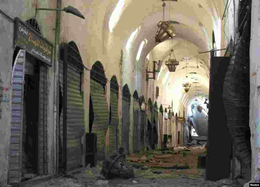 A burnt car in the al-Midan neighborhood in Damascus, July 20, 2012. 