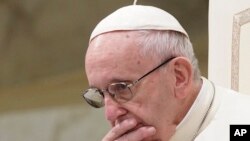 FILE - Pope Francis is caught in pensive mood during his weekly general audience at the Vatican. Francis' papacy has been thrown into crisis by accusations that he covered-up sexual misconduct by ex-Cardinal Theodore McCarrick, Aug. 22, 2018.