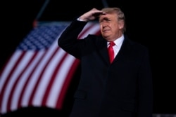 President Donald Trump arrives to speak at a campaign rally for Sen. Kelly Loeffler, R-Ga., and David Perdue at Dalton Regional Airport, Jan. 4, 2021, in Dalton, Ga.