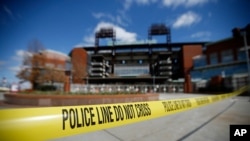 Police tape blocks an entrance to Citizens Bank Park, home of the Philadelphia Phillies baseball team, March 24, 2020, in Philadelphia.
