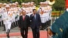 FILE - Cambodian Prime Minister Hun Sen, center right, and his Vietnamese counterpart Nguyen Xuan Phuc, center left, review an honor guard in Hanoi, Dec. 20, 2016. Hun Sen was in Vietnam for a two-day visit aimed at boosting relations between the two Southeast Asian neighbors. 