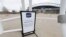 FILE - A "grounds closed" sign stands outside Empower Field at Mile High, the home of the NFL Denver Broncos, in Denver, April 30, 2020.