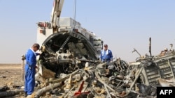 Russian emergency services personnel working at the crash site of a A321 Russian airliner in Wadi al-Zolomat, a mountainous area of Egypt's Sinai Peninsula. (Russian Emergency Ministry Handout photo)