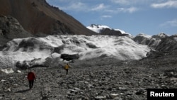Glaciers in China's bleak, rugged Qilian mountains are disappearing at a shocking rate as global warming brings unpredictable change and raises the prospect of crippling, long-term water shortages, scientists say. (REUTERS/Carlos Garcia Rawlins)
