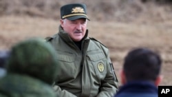 FILE - In this photo provided by the Belarusian Presidential Press Service, Belarus President Alexander Lukashenko speaks to military personnel during his visit to Oshmyany District, Grodno region of Belarus on March 26, 2024. 