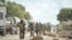 FILE - Soldiers with the African Union Mission in Somalia march through the town of Golweyn in Somalia's Lower Shabelle region, August 30, 2014, in this handout picture released by the African Union-United Nations Information Support Team.