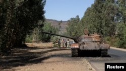 FILE - A burnt out tank stands near the town of Adwa, in Ethiopia's Tigray region, March 18, 2021.
